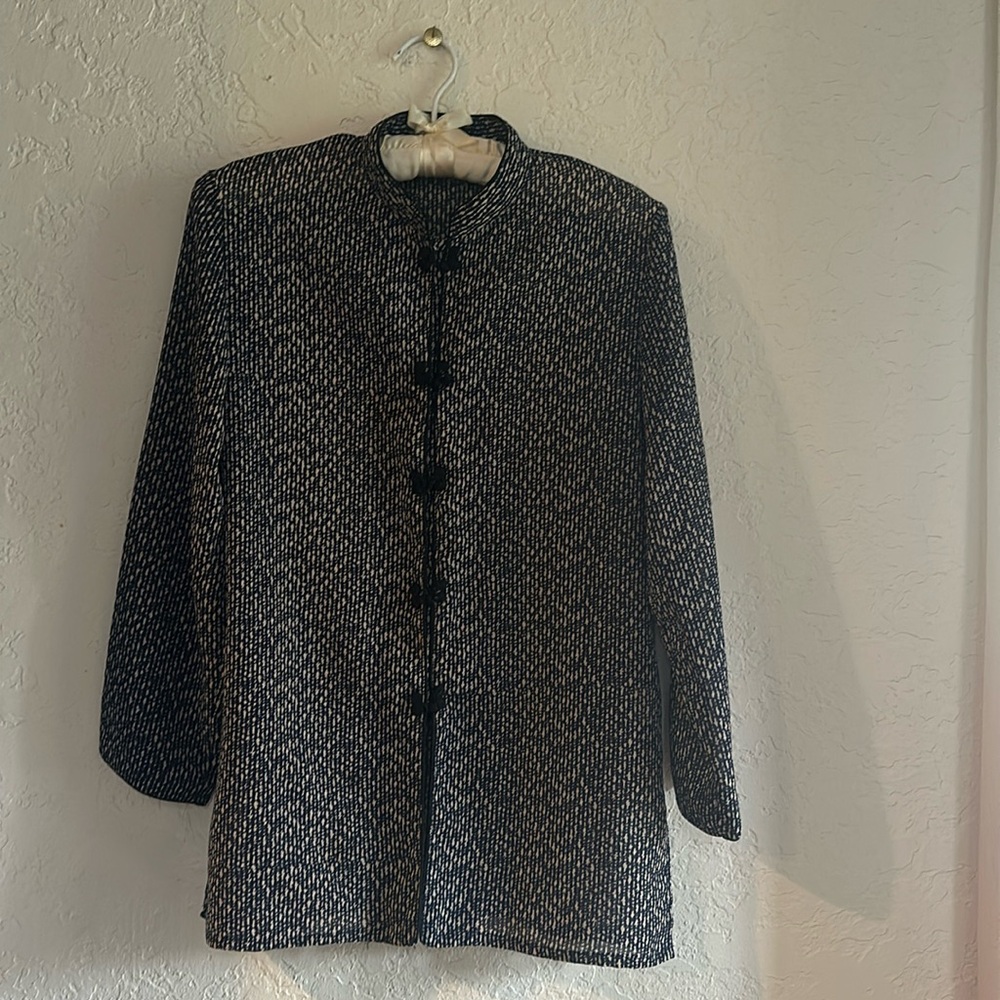 Blue and beige sheer blouse with fabric buttons. Hip length.
